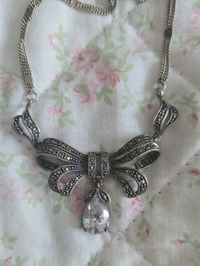 Silver Bow Pendant Necklace with Clear Teardrop Crystal